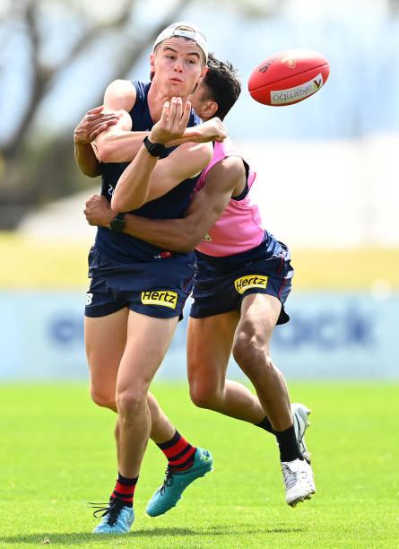 bayley-fritsch-of-the-demons-handballs-whilst-being-tackled-during-a-picture-id1357367625.jpg
